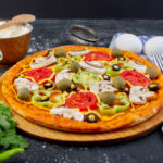 front-view-spicy-mushroom-pizza-with-red-tomatoes-bell-peppers-olives-mushrooms-all-sliced-inside-with-eggs-dark